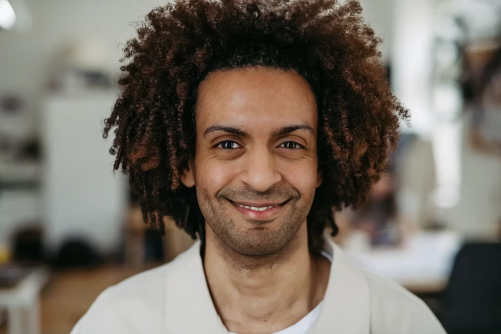 portrait of young multiracial man in office utc
